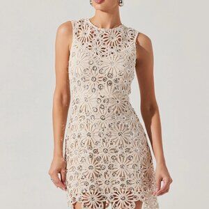 Crochet floral mini dress Sequin details throughout Exposed back with lace up cl